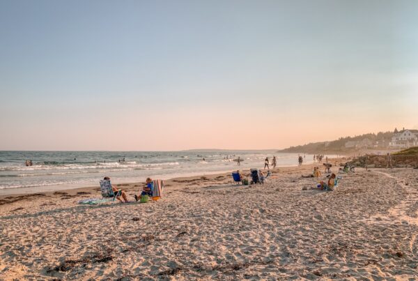 Higgins Beach offers up an expanse of soft sand and idyllic views (and some waves for the surfers).